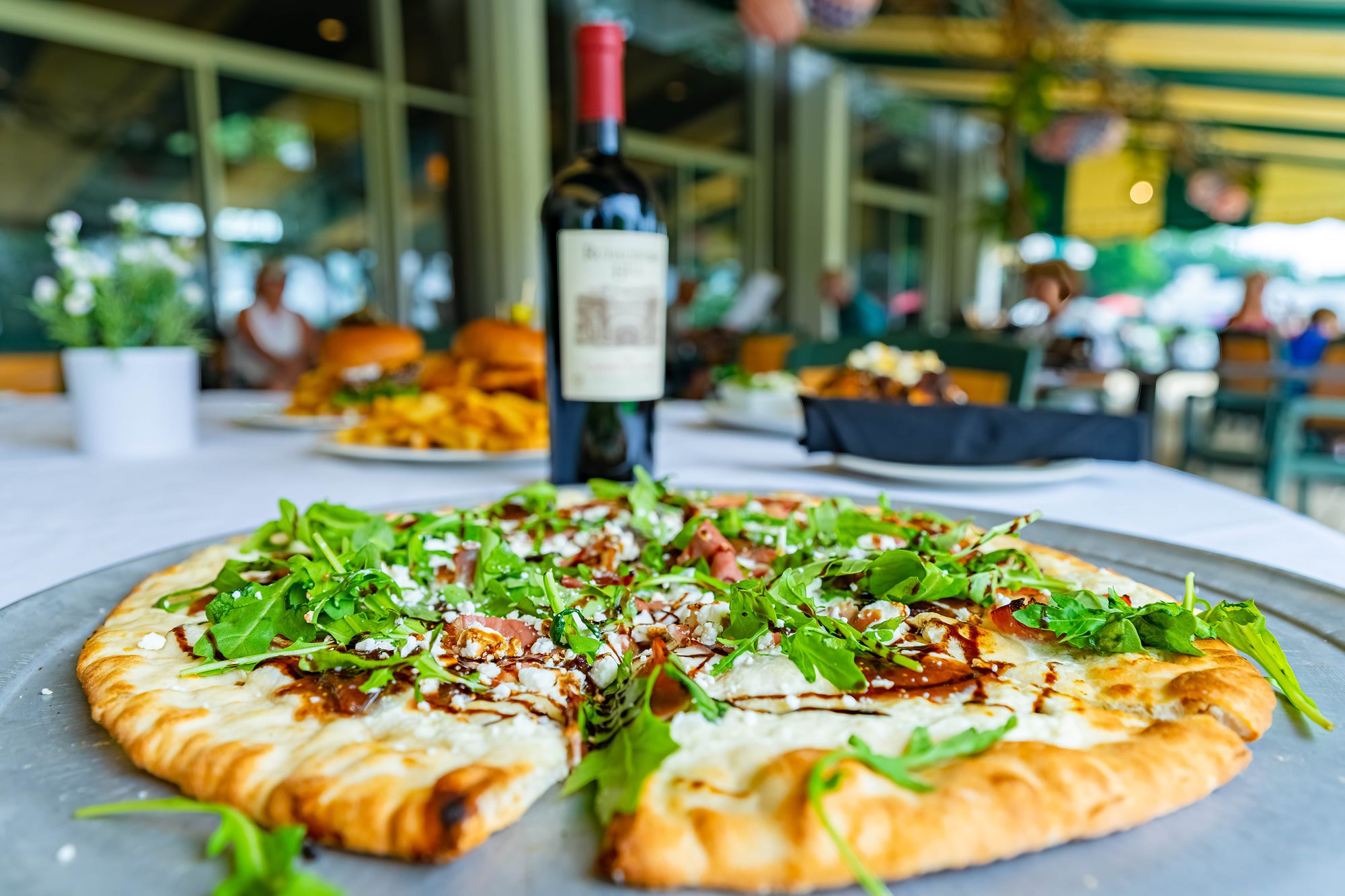 pizza_on_patio_with_wine-min